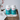 Two bottles of Conceive Plus ovulation support supplements on a wooden surface with a white background.