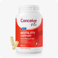 The image of the front side of the bottle of Conceive Plus Motility Support on a white background. There are also two capsules on the lower left corner of the image of the bottle